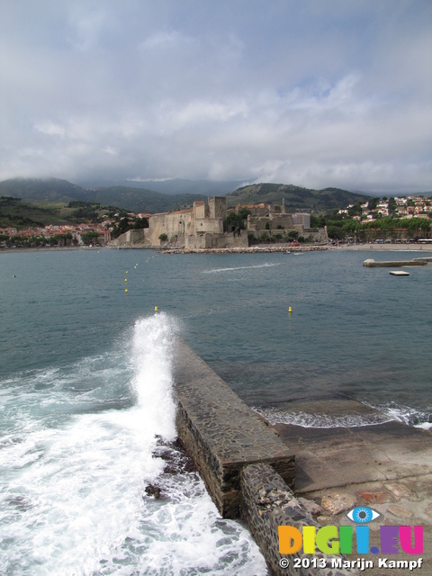 SX27381 Wave splashing against harbour wall in Collioure